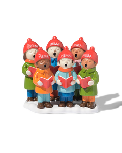 chorale sur scène devant la crèche